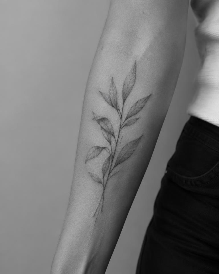 Fine-Line Botanical tattoo on Outer Forearm