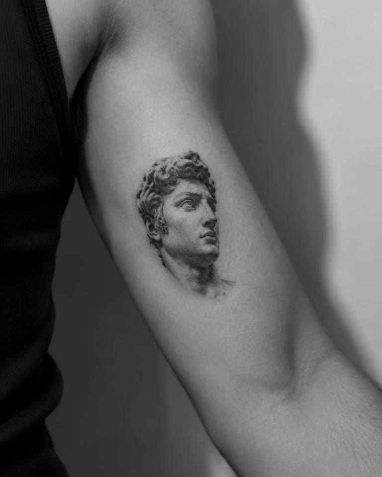 Micro-Realism Portrait tattoo on Inner Bicep