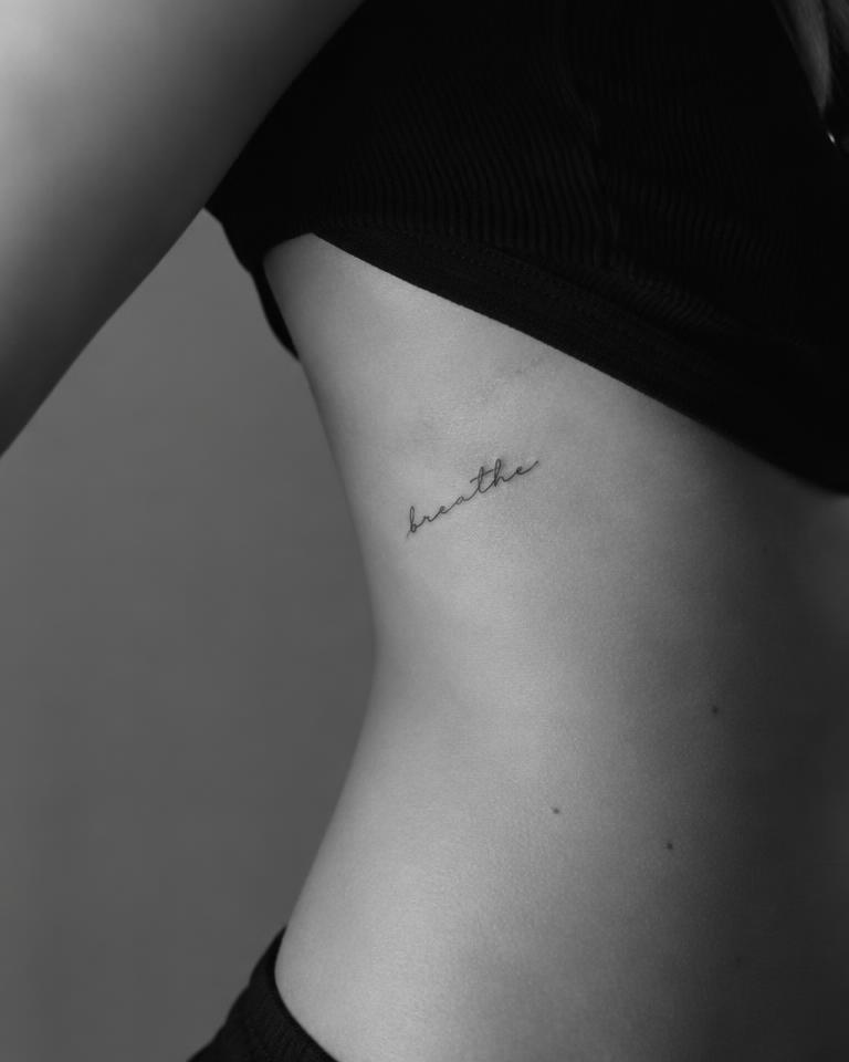 Fine-Line Script tattoo on Ribs